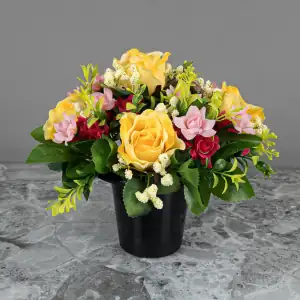 Artificial pale yellow roses, and pink & cerise mini-roses, with gyp and greenery in a full black plastic grave flower pot.
