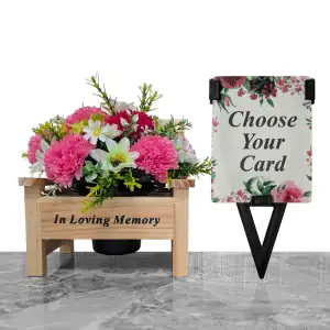 Artificial white dahlias, cerise & pink carnations, and white & green cosmos, with gyp and greenery in a sturdy wooden 'In Loving Memory' memorial bench with plastic grave flower pot, plus a laminate memorial card for mum, nan, or sister in a plastic holder.