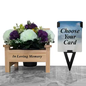 Artificial purple & honeydew carnations, and yellow & honeydew mini-roses, with gyp and greenery in a sturdy wooden 'In Loving Memory' memorial bench with plastic grave flower pot, plus a laminate memorial card for dad, grandad, husband, or brother in a plastic holder.